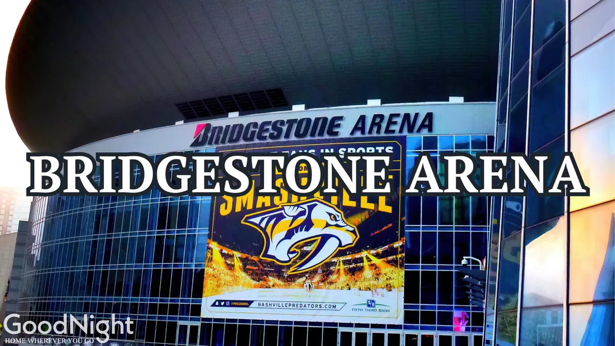 The exterior of Bridgestone Arena with a prominent Nashville Predators banner and modern architectural elements, suggesting a hot spot for major concerts, sporting events, and community gatherings.